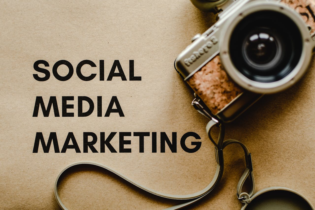 Home A vintage camera on brown paper with SOCIAL MEDIA MARKETING text, perfect for marketing visuals.